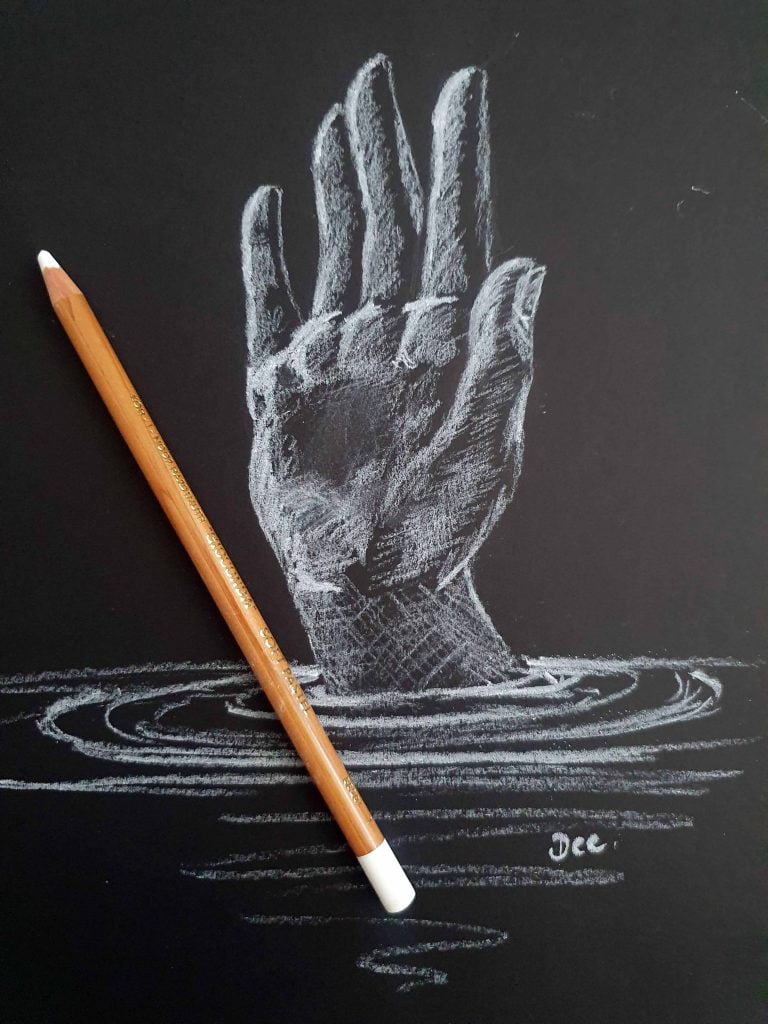A drawing of a hand reaching up out of water, in white charcoal pencil on black paper