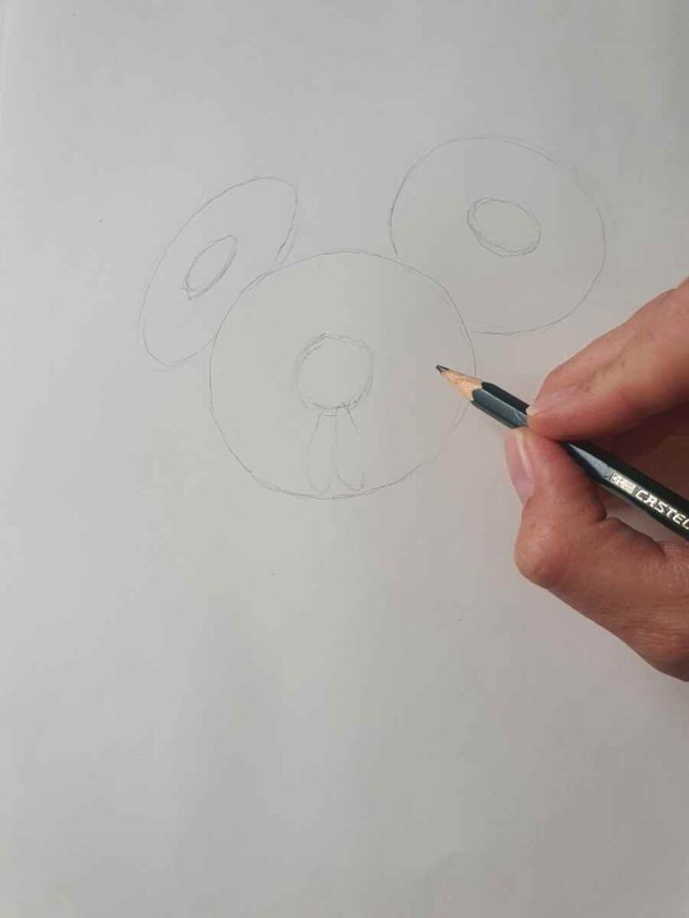 pencil drawing of three disk shapes