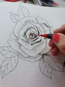 painting a pen rose with red watercolor brush pens